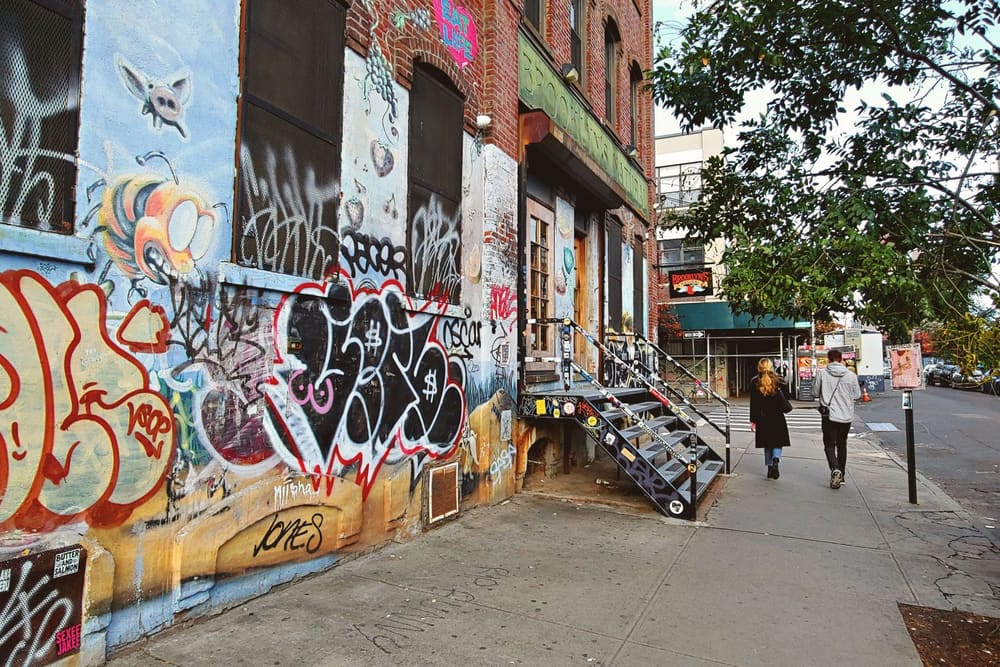 A mural-covered storefront in Bushwick, Brooklyn