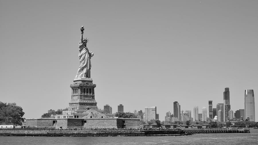 The Statue of Liberty with the Lower Manhattan skyline behind it