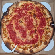A thin, crisp bar pie from Lee's Tavern in Staten Island, with charred edges and red sauce over cheese