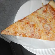A plain New York cheese slice on a paper plate